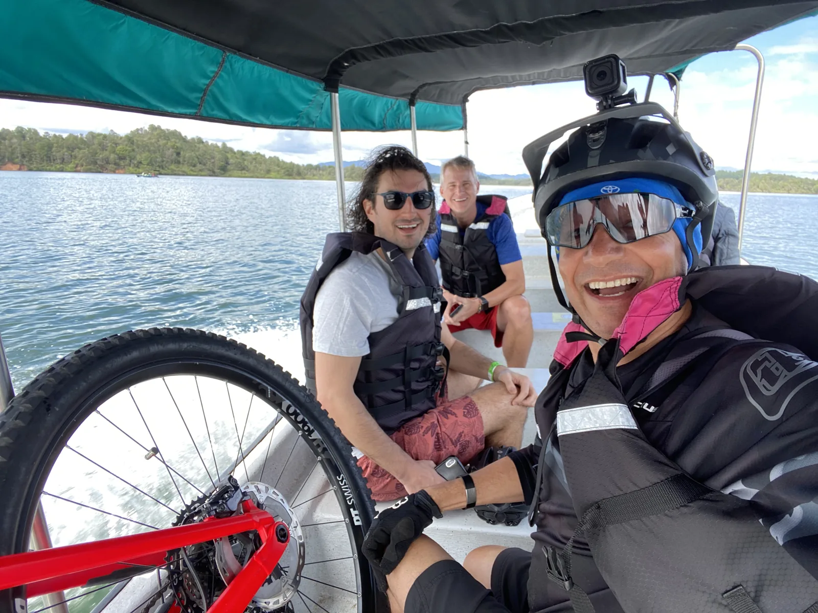 Riders on the Guatapé reservoir boat crossing