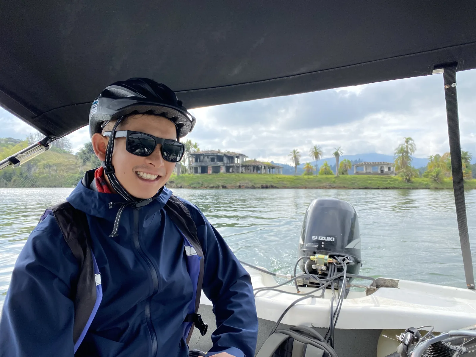 Cyclist on the Guatapé reservoir boat crossing