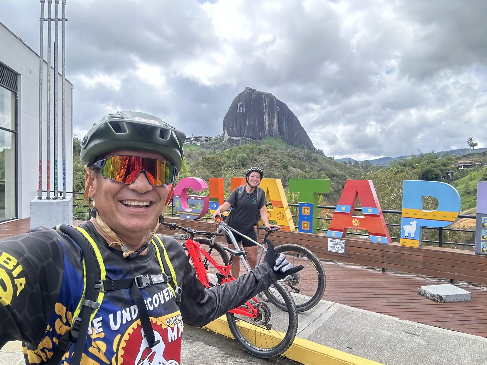 At the Guatapé sign with the Piedra del Peñol